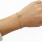 Feines Bettelarmband 585 Gold mit Zirkonia-Symbolanhängern Antragsring und kreuz am Handgelenk