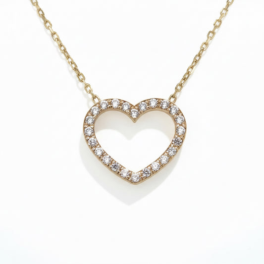 Offener Herzanhänger aus Gold mit funkelnden Steinen